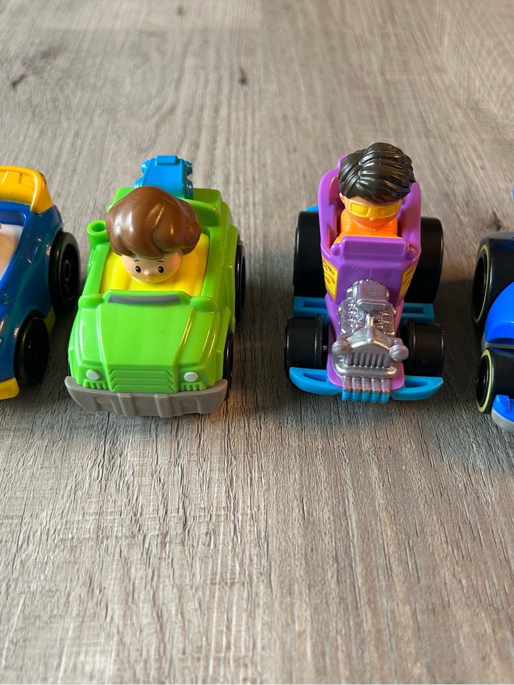 0114. Little People Wheelie Lot • 4 Items